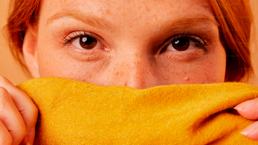 Woman wearing organic cotton shirt to prevent fabric allergy and skin irritation