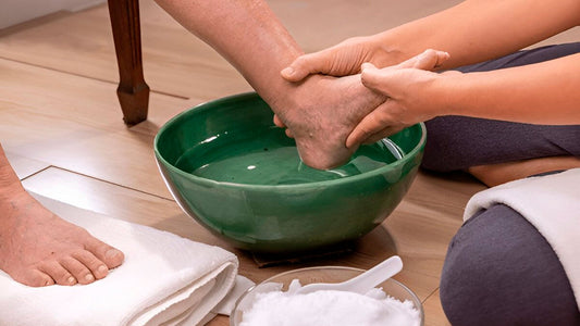 Foot soaking in Epsom salt water, swollen feet relief
