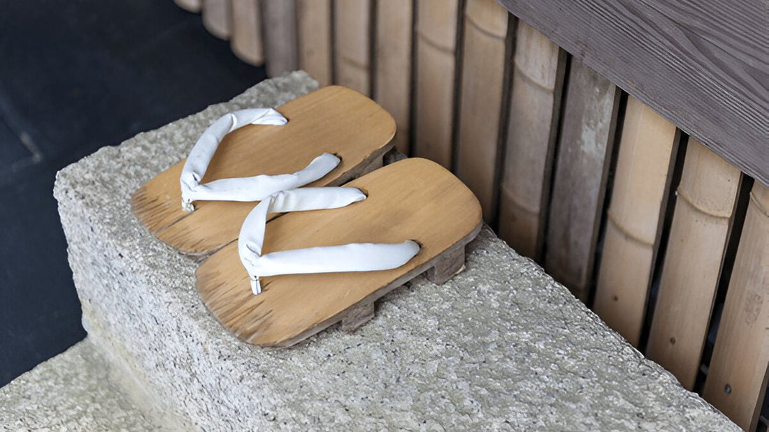 A traditional Japanese genkan with indoor slippers neatly arranged, showing the cultural practice of removing shoes before entering the house.
