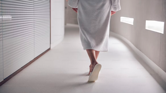 Woman wearing slippers indoors with warm light